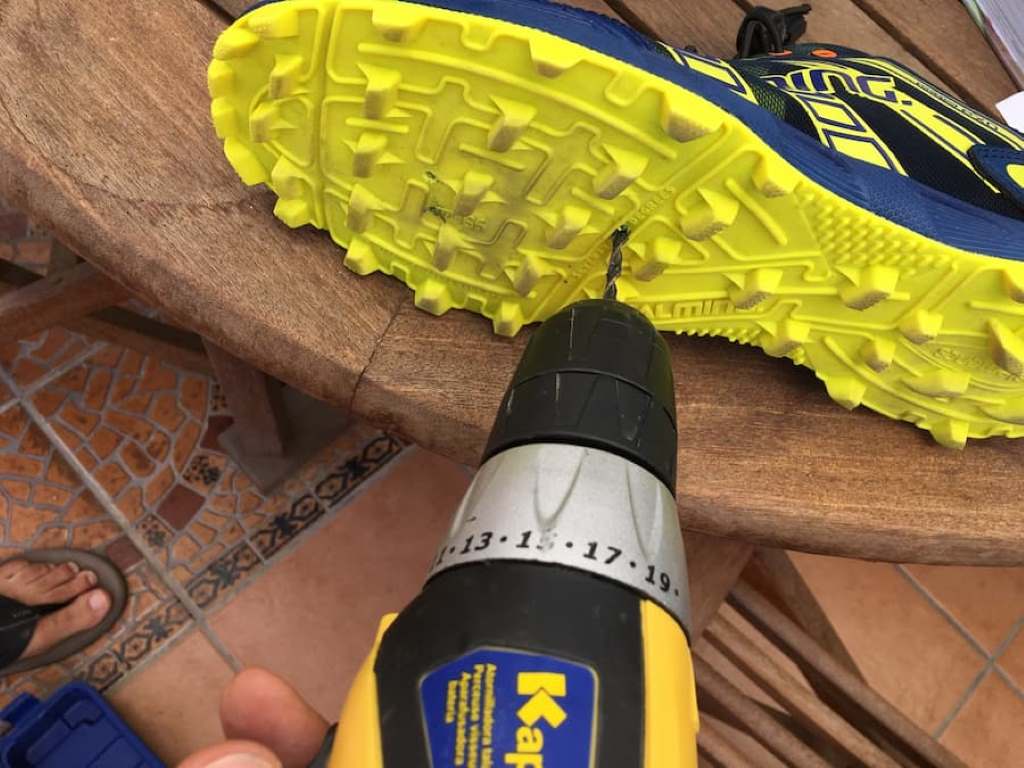 Close-up of Inov-8 X-Talon with DIY drainage holes for swimrun races.