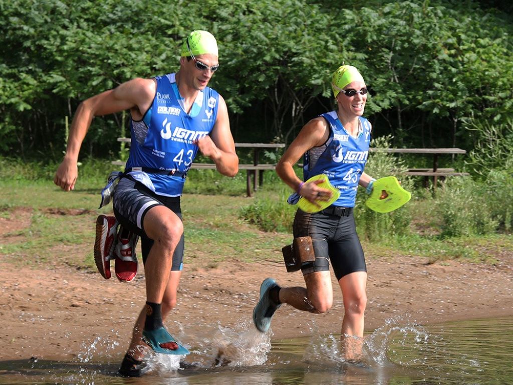 Swimrun gear laid out for first-time competitors, including wetsuit and shoes